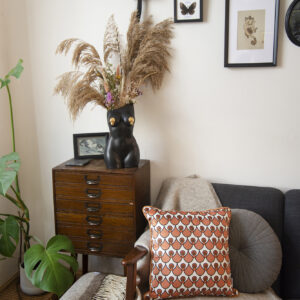 Black Femme vase in styled setting with other Mila Maven Products